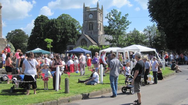 People gathering on the village green during the fete