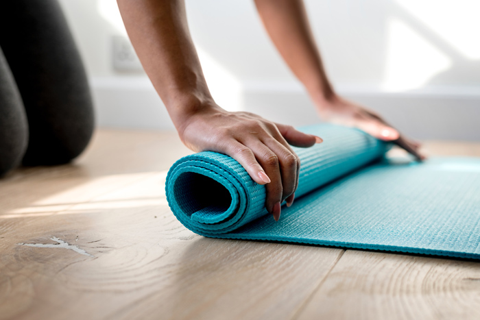 Yoga matt being rolled up